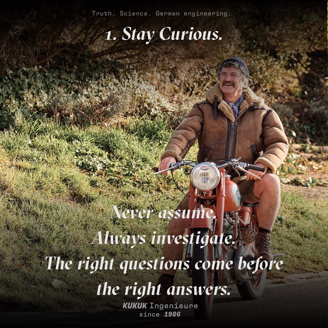 Klaus Kukuk on a historic motorcycle with the principle Stay Curious