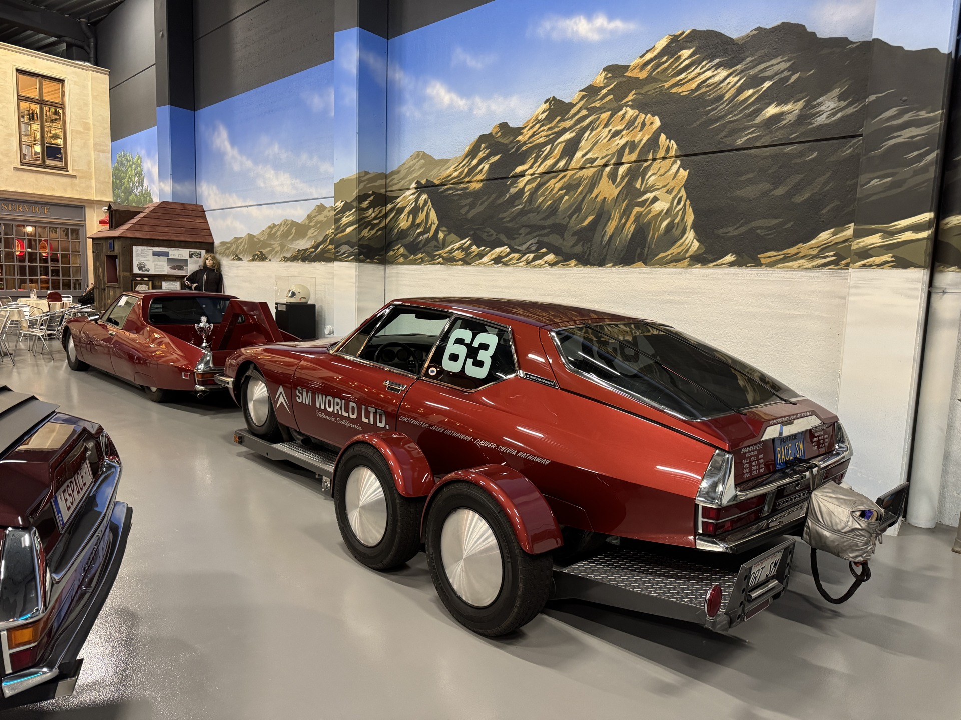 Red Citroën SM with SM World lettering and matching transporter