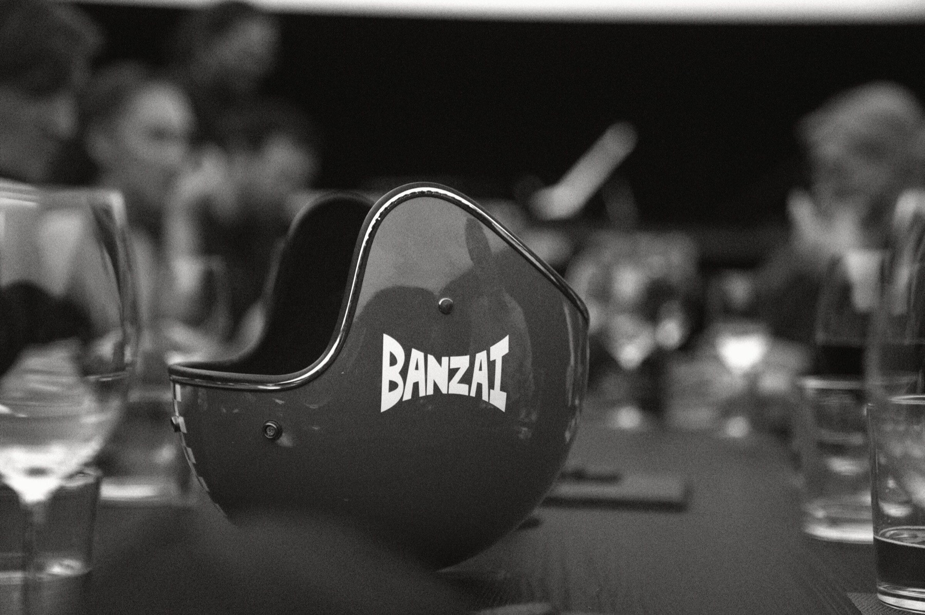A vintage Banzai helmet on the dinner table.
