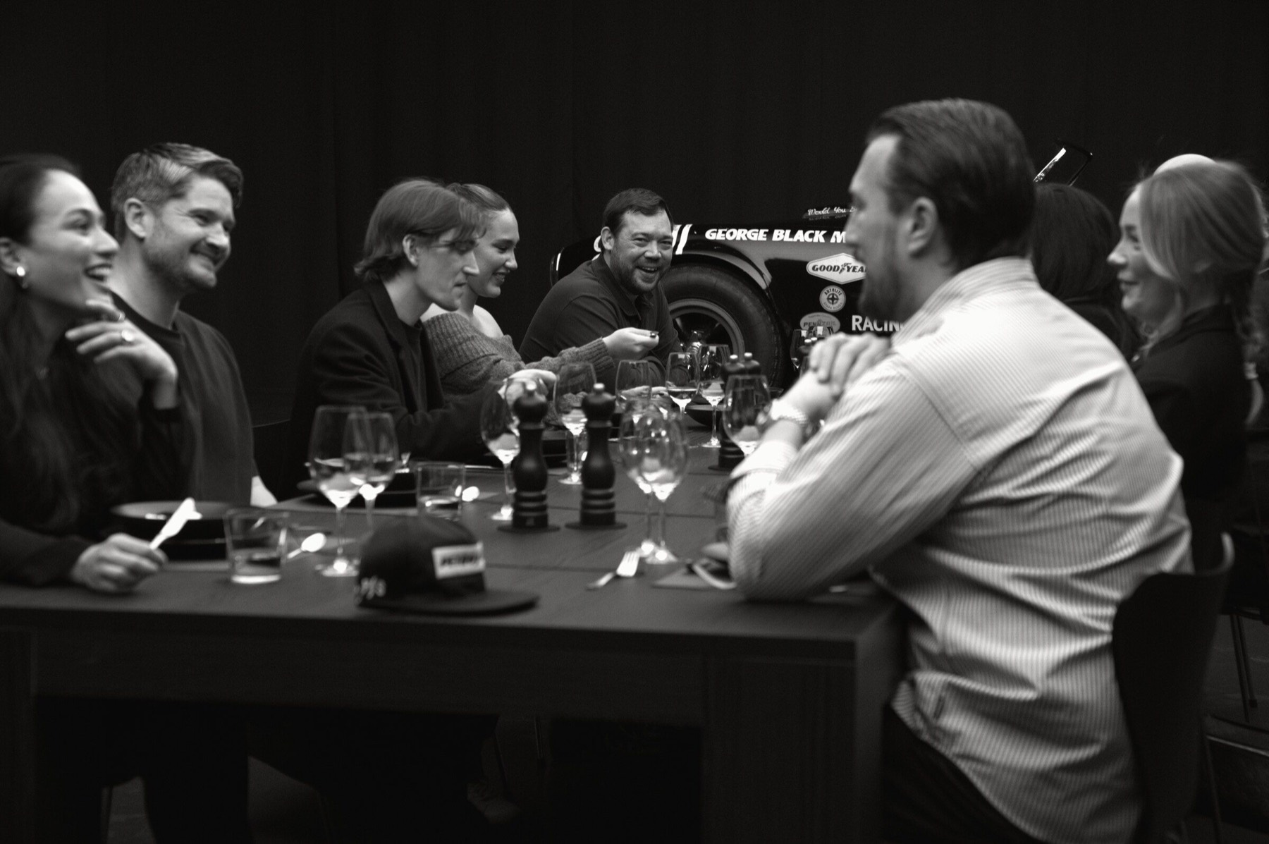 Guests laughing together around the table.